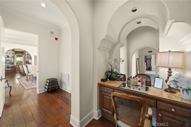 15 Sarteano Dr, Newport Coast, CA 92657 - corridor with arched walkways, crown molding, dark wood-style flooring, and recessed lighting