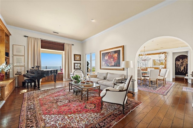 15 Sarteano Dr, Newport Coast, CA 92657 - living area featuring arched walkways, dark wood finished floors, crown molding, and a chandelier