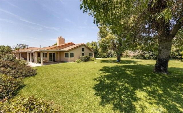 1144 Jasmine St, Redlands, CA 92374 - view of green lawn featuring a patio area