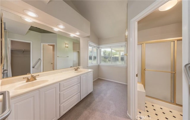 1144 Jasmine St, Redlands, CA 92374 - bathroom with a stall shower, double vanity, vaulted ceiling, and recessed lighting