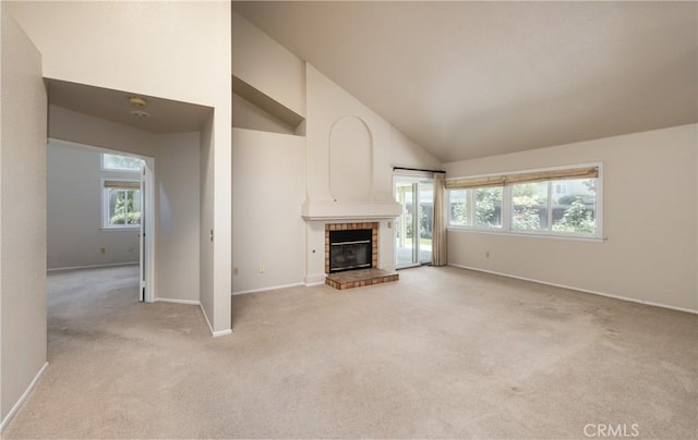 1144 Jasmine St, Redlands, CA 92374 - unfurnished living room with light colored carpet, plenty of natural light, a fireplace, and high vaulted ceiling