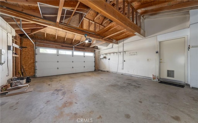 1144 Jasmine St, Redlands, CA 92374 - garage featuring a garage door opener