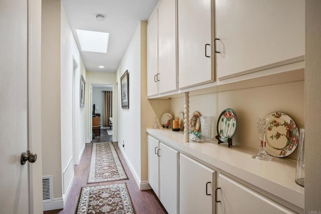 6034 Wenrich Dr, San Diego, CA 92120 - hall featuring dark wood-style floors, a skylight, and recessed lighting