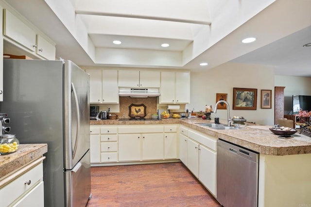 6034 Wenrich Dr, San Diego, CA 92120 - kitchen with stainless steel appliances, a peninsula, under cabinet range hood, cream cabinets, and recessed lighting