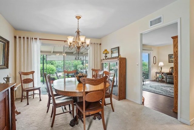 6034 Wenrich Dr, San Diego, CA 92120 - carpeted dining area featuring a chandelier and baseboards