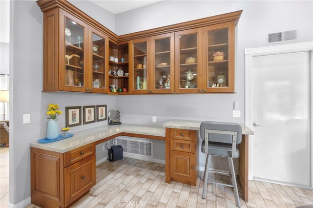 21845 Tumbleweed Cir, Lake Forest, CA 92630 - office space with built in study area and light wood-style floors