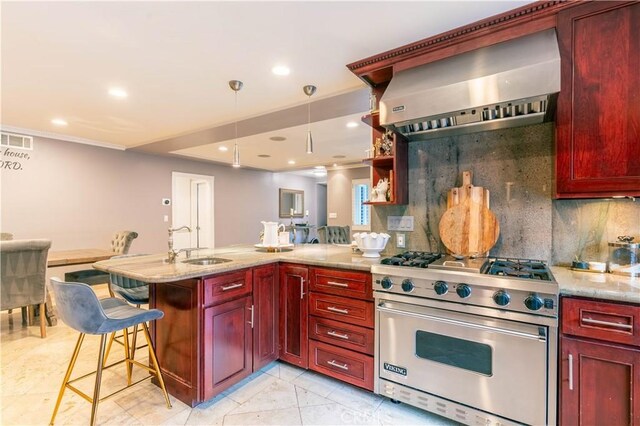 13837 Sylvan St, Valley Glen, CA 91401 - kitchen featuring premium range, reddish brown cabinets, wall chimney exhaust hood, a peninsula, and recessed lighting