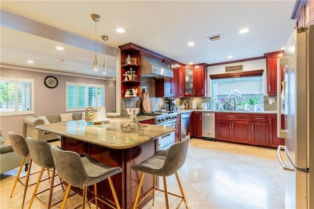 13837 Sylvan St, Valley Glen, CA 91401 - kitchen with appliances with stainless steel finishes, dark brown cabinets, wall chimney exhaust hood, ornamental molding, and a peninsula