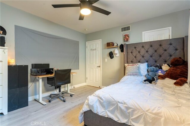 13837 Sylvan St, Valley Glen, CA 91401 - bedroom with wood finished floors, an office area, and a ceiling fan