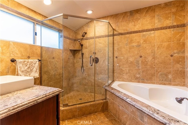 13837 Sylvan St, Valley Glen, CA 91401 - full bath with a garden tub, a stall shower, tile walls, vanity, and recessed lighting