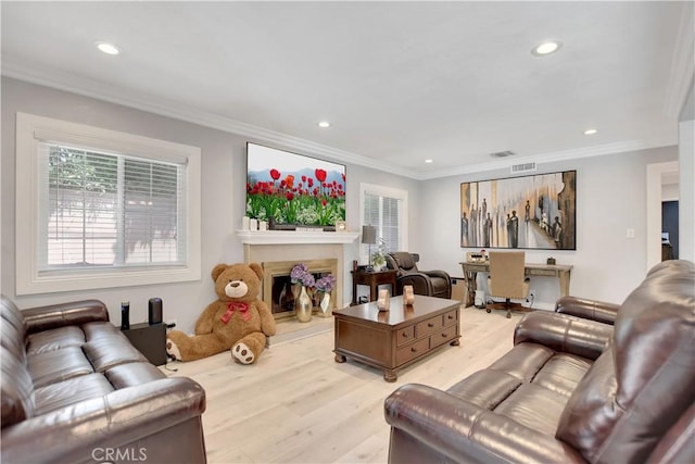 1305 E Eckerman Ave, West Covina, CA 91790 - living room with light wood finished floors, recessed lighting, crown molding, and a fireplace with raised hearth