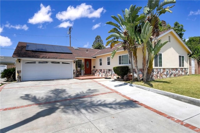 1305 E Eckerman Ave, West Covina, CA 91790 - single story home featuring stone siding, stucco siding, concrete driveway, and solar panels