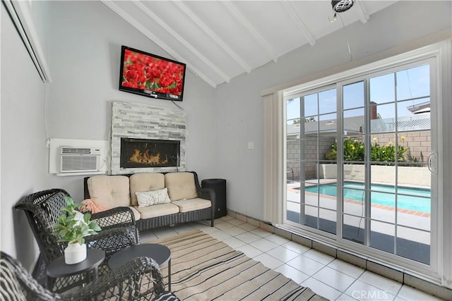 1305 E Eckerman Ave, West Covina, CA 91790 - living area with tile patterned floors, a wall unit AC, and a fireplace