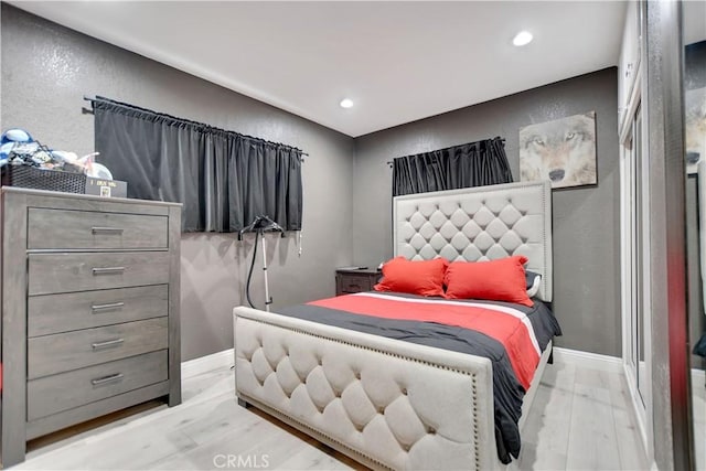 1305 E Eckerman Ave, West Covina, CA 91790 - bedroom with wood finished floors, a textured wall, and recessed lighting