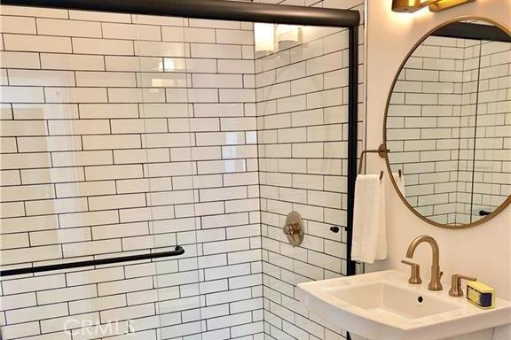 341 W Whiting Ave, Fullerton, CA 92832 - bathroom with a sink and tiled shower