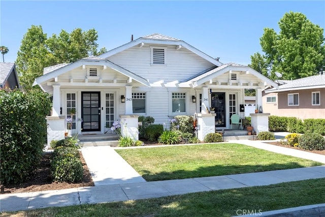 341 W Whiting Ave, Fullerton, CA 92832 - bungalow-style house featuring a porch and a front lawn