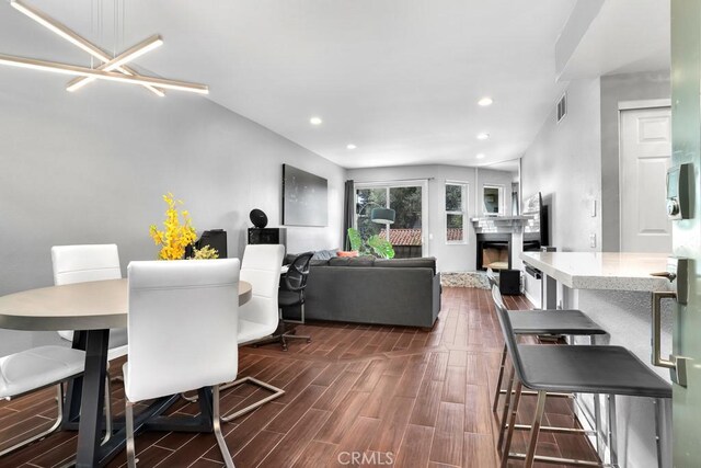 6323 Reseda Blvd Unit 39, Tarzana, CA 91335 - dining area featuring dark wood finished floors, a fireplace, and recessed lighting