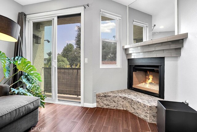 6323 Reseda Blvd Unit 39, Tarzana, CA 91335 - entryway with wood finished floors, plenty of natural light, and a fireplace