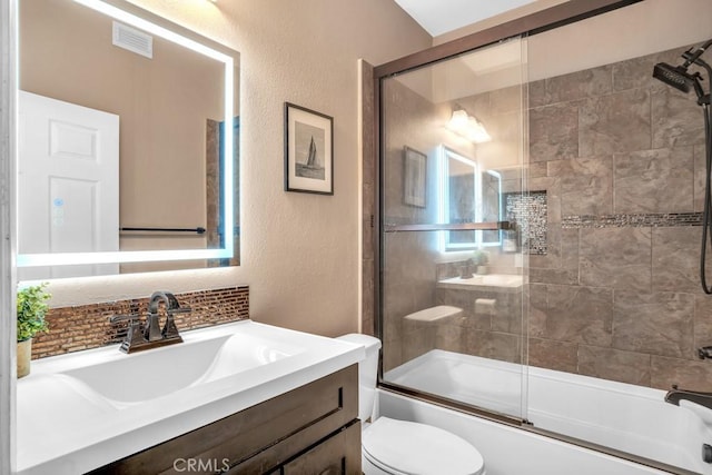 6323 Reseda Blvd Unit 39, Tarzana, CA 91335 - full bathroom featuring vanity, decorative backsplash, a textured wall, and bath / shower combo with glass door