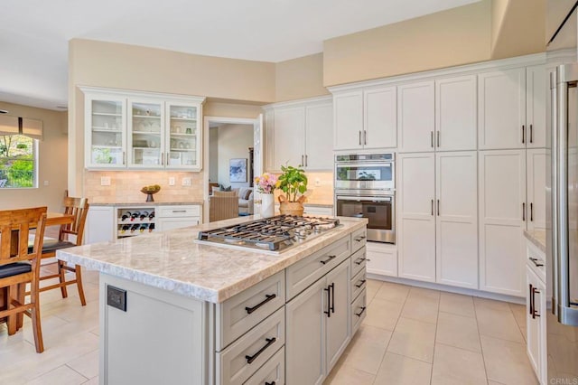 282 Camino Del Postigo, Escondido, CA 92029 - kitchen featuring stainless steel appliances, light tile patterned flooring, tasteful backsplash, and white cabinets
