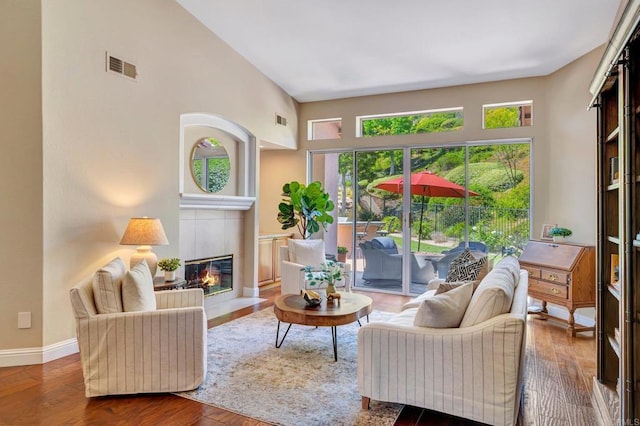 282 Camino Del Postigo, Escondido, CA 92029 - living area with a fireplace, wood finished floors, and a high ceiling
