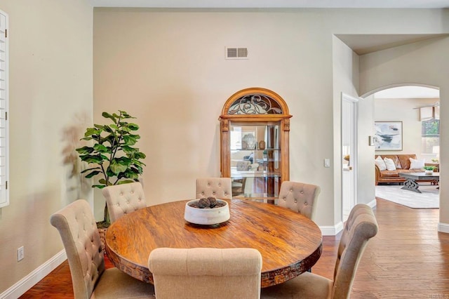 282 Camino Del Postigo, Escondido, CA 92029 - dining space featuring hardwood / wood-style floors and arched walkways