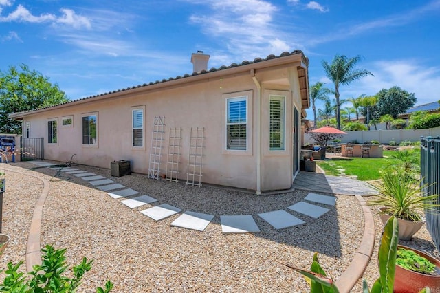 282 Camino Del Postigo, Escondido, CA 92029 - view of side of home featuring stucco siding and a chimney