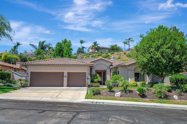 282 Camino Del Postigo, Escondido, CA 92029 - mediterranean / spanish home with a garage, stucco siding, driveway, and a tiled roof