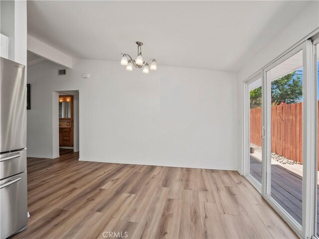27545 Santa Clarita Rd, Saugus, CA 91350 - unfurnished dining area with a chandelier and light wood-style floors