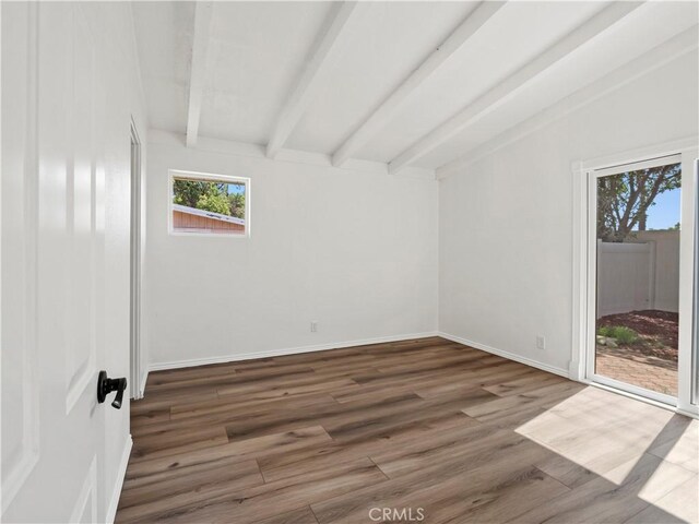 27545 Santa Clarita Rd, Saugus, CA 91350 - unfurnished room with healthy amount of natural light, beamed ceiling, and wood finished floors