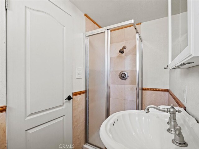 27545 Santa Clarita Rd, Saugus, CA 91350 - bathroom with a sink and a shower stall