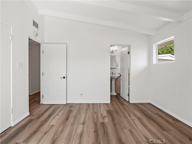 27545 Santa Clarita Rd, Saugus, CA 91350 - unfurnished bedroom featuring wood finished floors and ensuite bathroom
