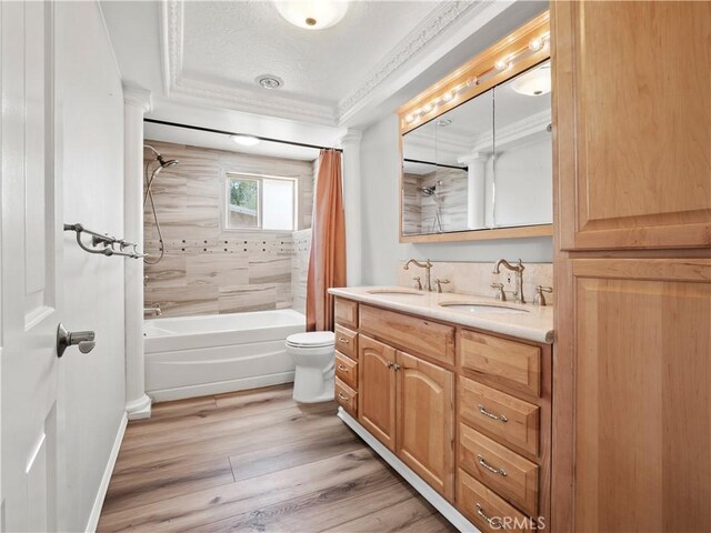 27545 Santa Clarita Rd, Saugus, CA 91350 - bathroom featuring shower / tub combo, double vanity, wood finished floors, ornamental molding, and a textured ceiling