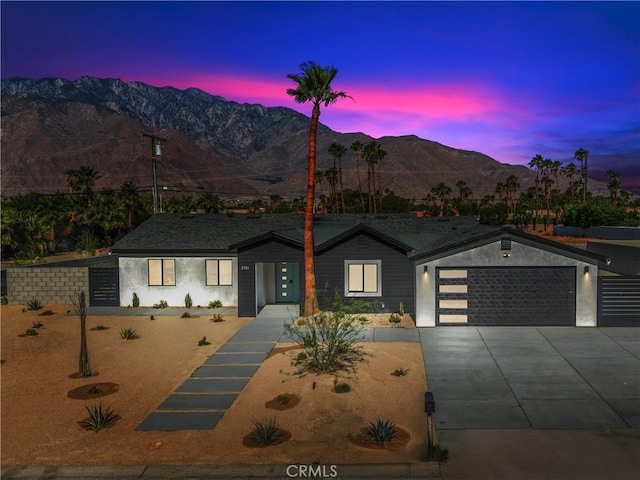2901 N Biskra Rd, Palm Springs, CA 92262 - view of front of home featuring a mountain view, driveway, a garage, and stucco siding