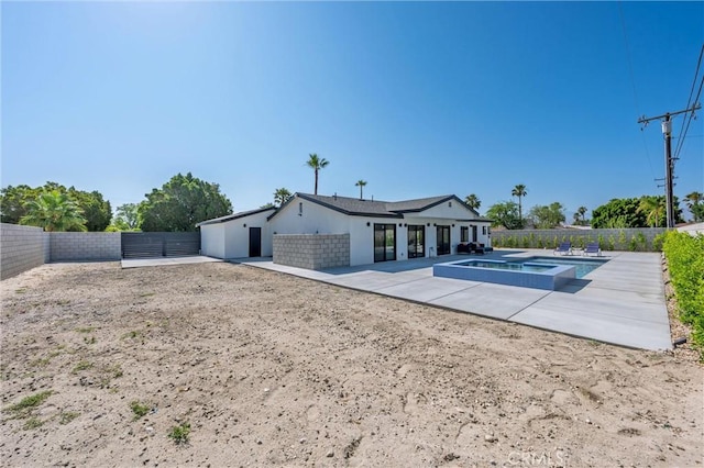 2901 N Biskra Rd, Palm Springs, CA 92262 - rear view of house with a patio, a fenced backyard, and a pool with connected hot tub