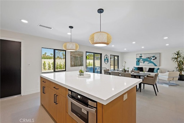 2901 N Biskra Rd, Palm Springs, CA 92262 - kitchen with a kitchen island, light countertops, recessed lighting, hanging light fixtures, and stainless steel oven