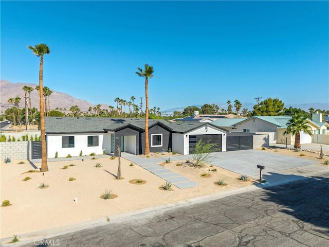 2901 N Biskra Rd, Palm Springs, CA 92262 - ranch-style house featuring driveway, a mountain view, and an attached garage