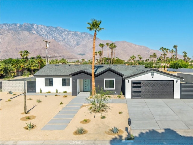 2901 N Biskra Rd, Palm Springs, CA 92262 - ranch-style house featuring a mountain view, driveway, and a garage