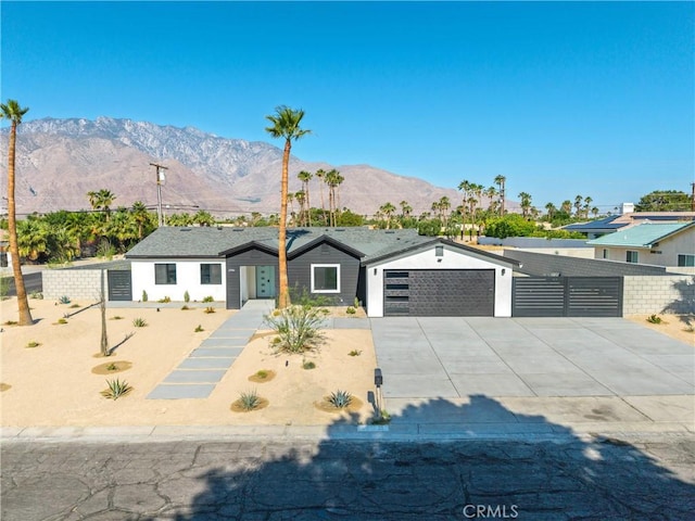 2901 N Biskra Rd, Palm Springs, CA 92262 - single story home with driveway, a mountain view, and a garage