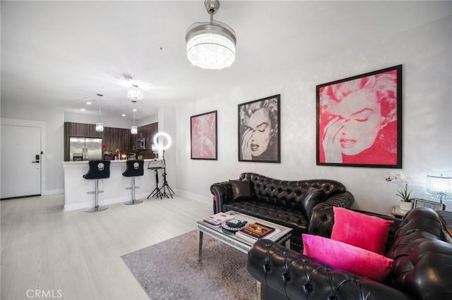 24545 Town Center Dr Unit 5405, Valencia, CA 91355 - living area featuring light wood-style floors and baseboards