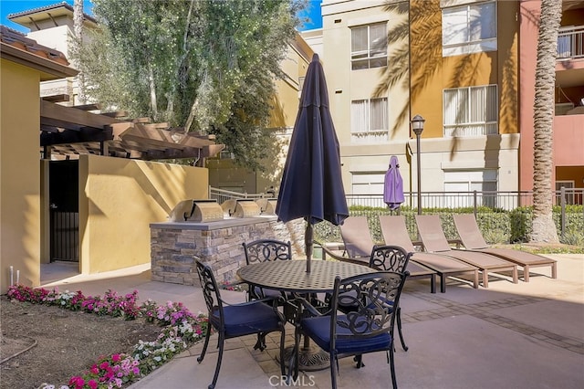 24545 Town Center Dr Unit 5405, Valencia, CA 91355 - view of patio featuring area for grilling, a pergola, and outdoor dining space