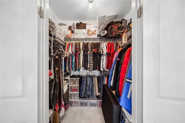 24545 Town Center Dr Unit 5405, Valencia, CA 91355 - walk in closet featuring wood finished floors