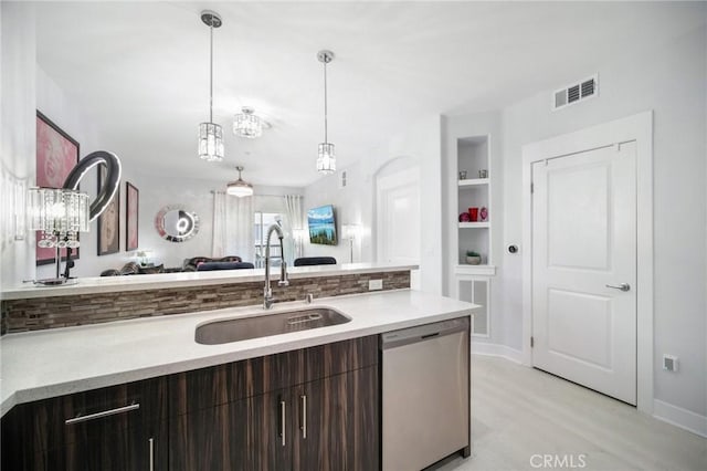 24545 Town Center Dr Unit 5405, Valencia, CA 91355 - kitchen featuring stainless steel dishwasher, light countertops, dark brown cabinetry, and light wood-style flooring