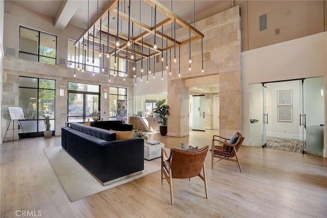 24545 Town Center Dr Unit 5405, Valencia, CA 91355 - lobby featuring a high ceiling, beam ceiling, and coffered ceiling