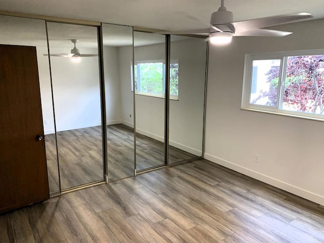 1878 Wolviston Way, San Diego, CA 92154 - unfurnished bedroom with wood finished floors, a closet, and a ceiling fan