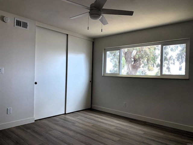 1878 Wolviston Way, San Diego, CA 92154 - unfurnished bedroom with wood finished floors, a closet, and a ceiling fan