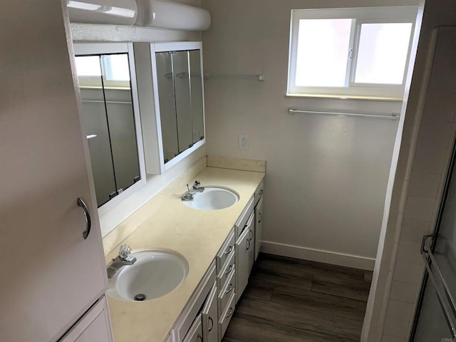 1878 Wolviston Way, San Diego, CA 92154 - full bathroom with double vanity, wood finished floors, and a shower with shower door