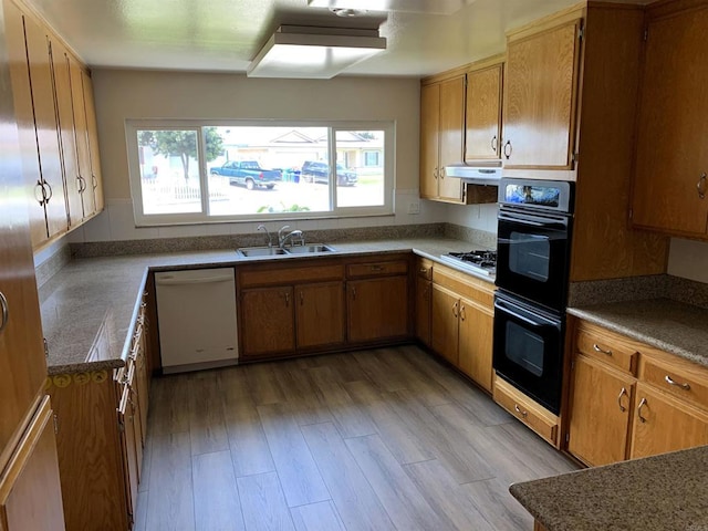 1878 Wolviston Way, San Diego, CA 92154 - kitchen featuring dishwasher, light wood-style flooring, gas cooktop, and brown cabinetry