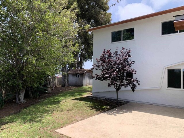 1878 Wolviston Way, San Diego, CA 92154 - view of green lawn with a patio and a shed