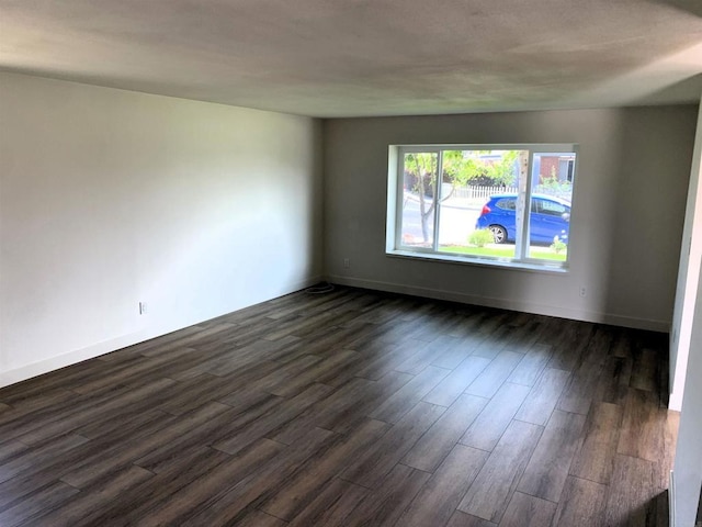 1878 Wolviston Way, San Diego, CA 92154 - empty room featuring dark wood-style flooring and baseboards